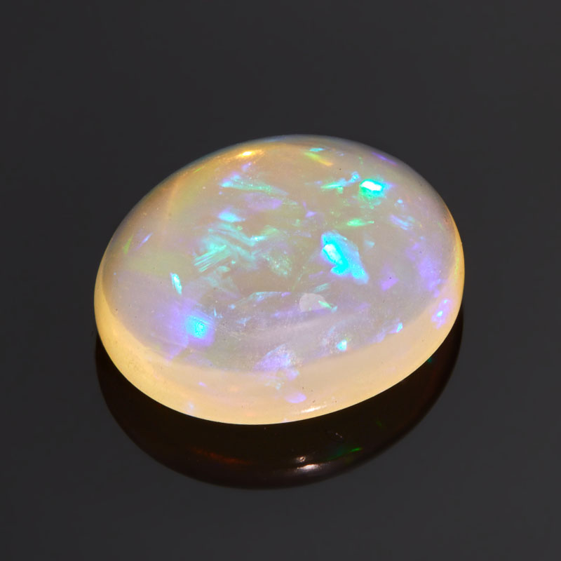 

Кабошон опал благородный желтый 16*13,5*6,5 мм