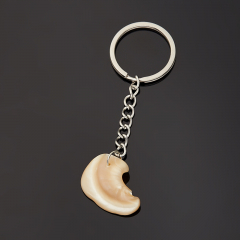 Брелок перламутр бежевый Индонезия (сталь хир.) 2,5-3 см